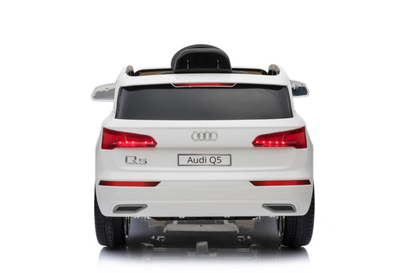 Rear view of a white Audi Q5 SUV with taillights illuminated and license plate reading 'Audi Q5'