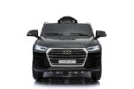 Front view of a black Audi Q5 model car with a prominent grille and illuminated headlights.