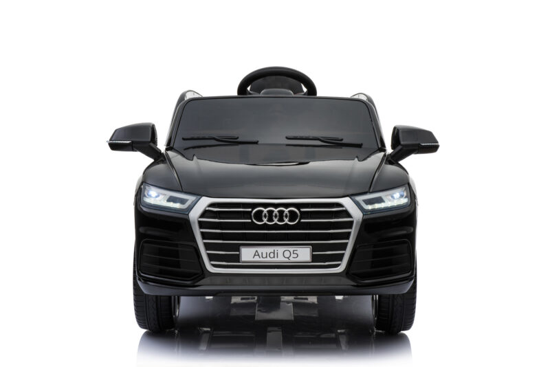 Front view of a black Audi Q5 model car with a prominent grille and illuminated headlights.