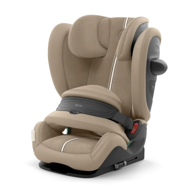 Beige padded child car seat with head support, side wings, and a five-point harness system ready for installation