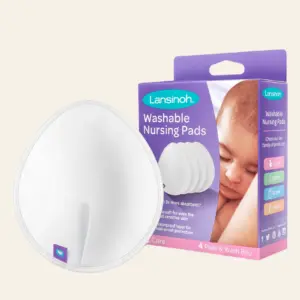 Lansinoh washable nursing pads box with round white pads in foreground, pastel background