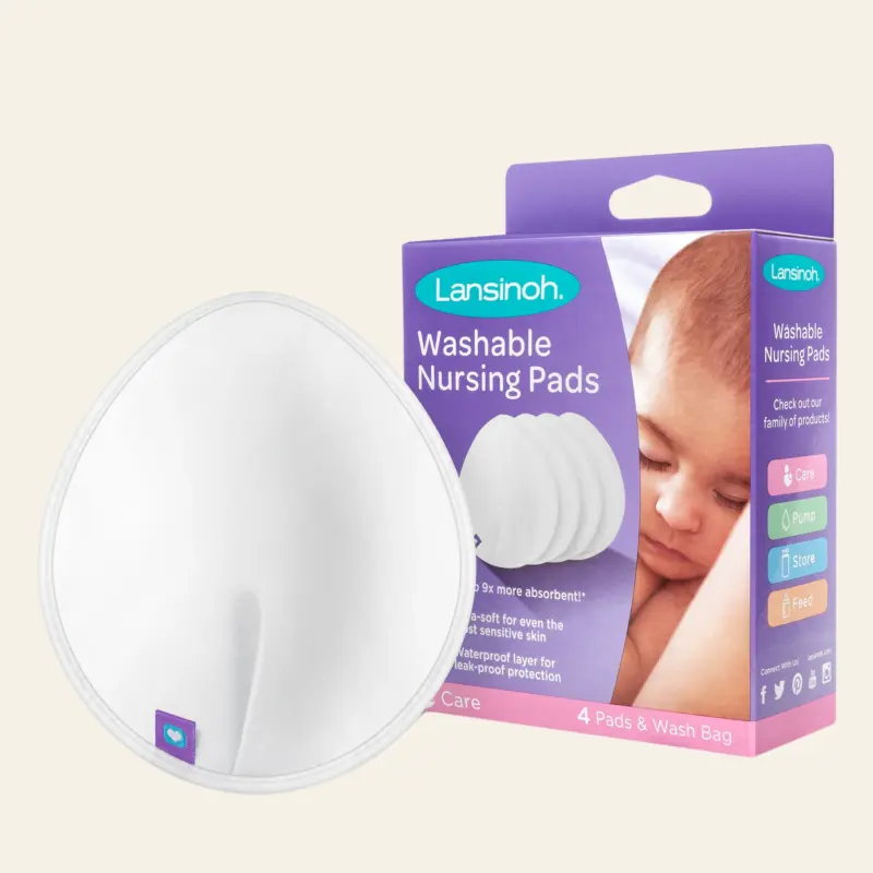 Lansinoh washable nursing pads box with round white pads in foreground, pastel background