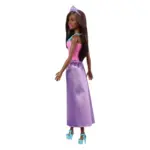 Doll in a pink corset top, purple satin skirt, blue necklace, blue heels, and a purple tiara, posed in profile.