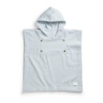 Light blue hooded baby poncho towel with brass snap buttons on the chest/shoulder area