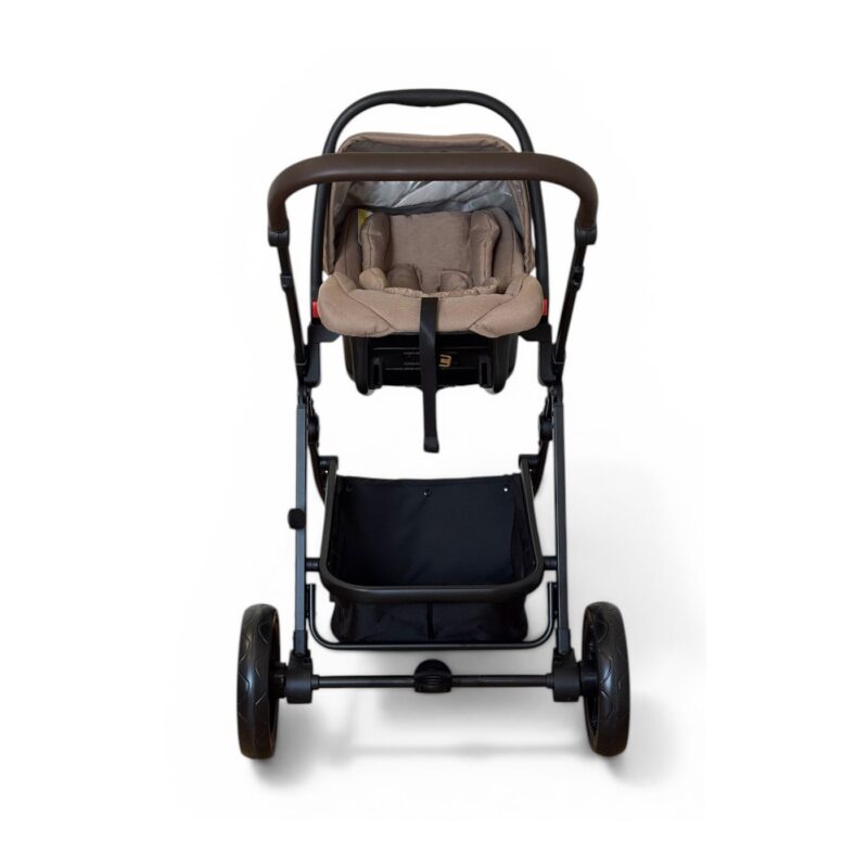 Front view of a beige infant car seat mounted on a black stroller frame with a brown handlebar and large wheels on each side