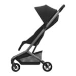 Stroller with a black canopy and gray frame, three wheels, and a large storage basket underneath.