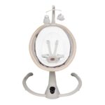 Round infant pod on a stand with a safety harness inside; hanging owl and cloud toys above.