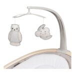 White and gray baby crib mobile with plush owl and cloud shapes hanging from a curved arm above a crib.