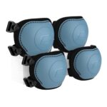 Four blue protective knee pads with black straps mounted on a white board or surface.