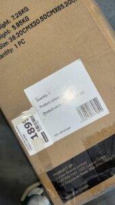 Brown cardboard box with a white shipping label showing a barcode and product text (Made in China sticker visible).”,