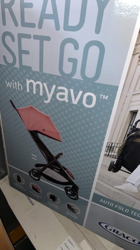 Advertisement poster for a pink-canopy stroller with teal dotted background and the slogan 'Ready Set Go with my baby'.