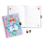 Open decorative notebook with a blue floral-covered journal beside an open lined-page notebook, plus a small brass lock and two keys nearby