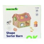 Shape Sorter Barn toy by TookyToy: a wooden barn with animals and shape pieces for sorting by shape and color pieces nearby