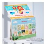 Colorful desk calendar with monthly pages turning, showing 'Months' on a bright blue sky background with clouds and cartoon art.