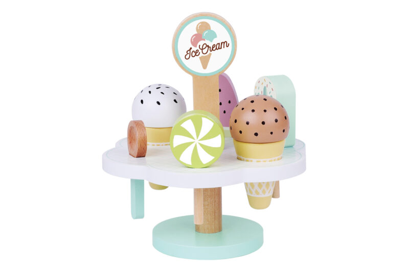 Toy ice cream stand with pastel scoops and cones on a round base, made of wood and plastic pieces in soft colors.