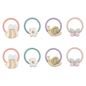 Set of eight pastel hair ties with cute charms: bee, flower, snail, and glitter bow, arranged in two rows.