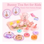 Pink bunny-themed kids' tea set with cups, teapot, tray and pastries arranged on a pale pink background