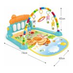 Colorful baby play gym with rainbow arch, hanging plush toys, and a padded animal-themed mat.