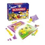 Junior Scrabble Disney edition: game box, colorful board, and yellow letter tiles spilling from a purple drawstring bag.