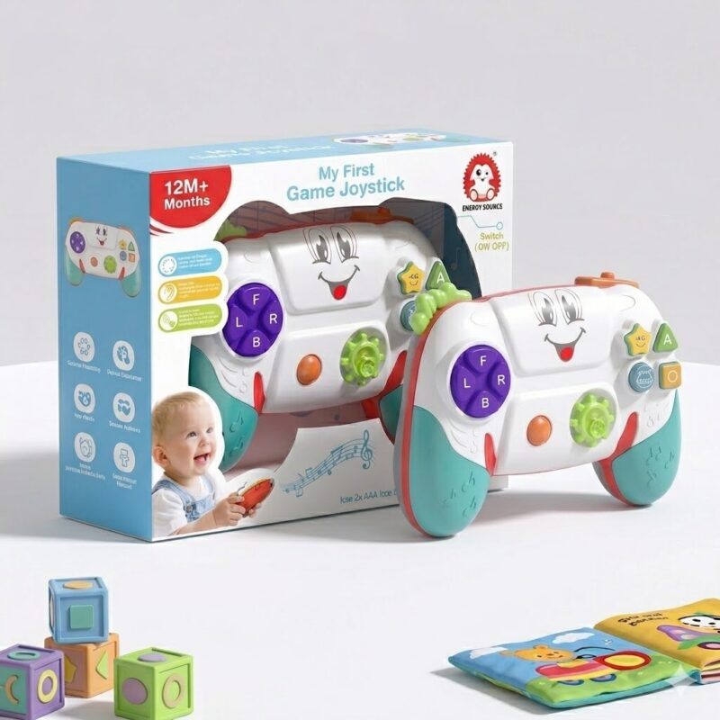 joystic naslovna Boxed 'My First Game Joystick' toy set for 12+ months, with two cartoon joysticks and colorful blocks nearby for playtime learning.