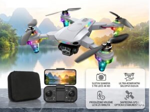 Quadcopter drone with four propellers and colorful LEDs hovering above a lake, remote controller and smartphone showing the camera view, plus a black carry case nearby.
