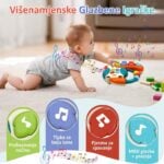 Baby crawling on a carpet reaches a colorful musical toy steering wheel with floating musical notes around it; four rounded color tabs sit at the bottom in green, blue, red, and teal.