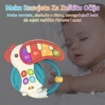 Sleeping baby with a colorful musical toy shaped like a monkey, featuring a curved red piano arc and bright buttons; promotes soothing, eye-friendly soft light.