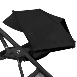 Close-up of a black stroller canopy attached to a metal frame, showing the Balios badge.