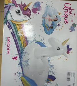 Box art for a white unicorn inflatable pool float with a golden horn and rainbow mane, surrounded by colorful stars and a small blue swimmer illustration.